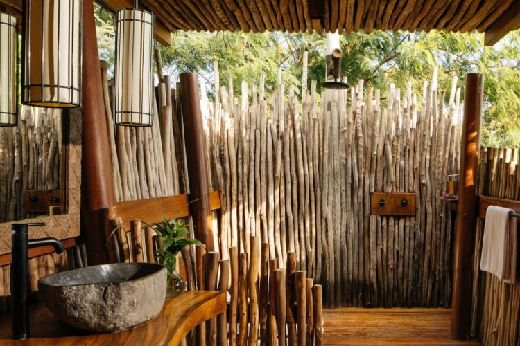 Open-air driftwood shower at the villa