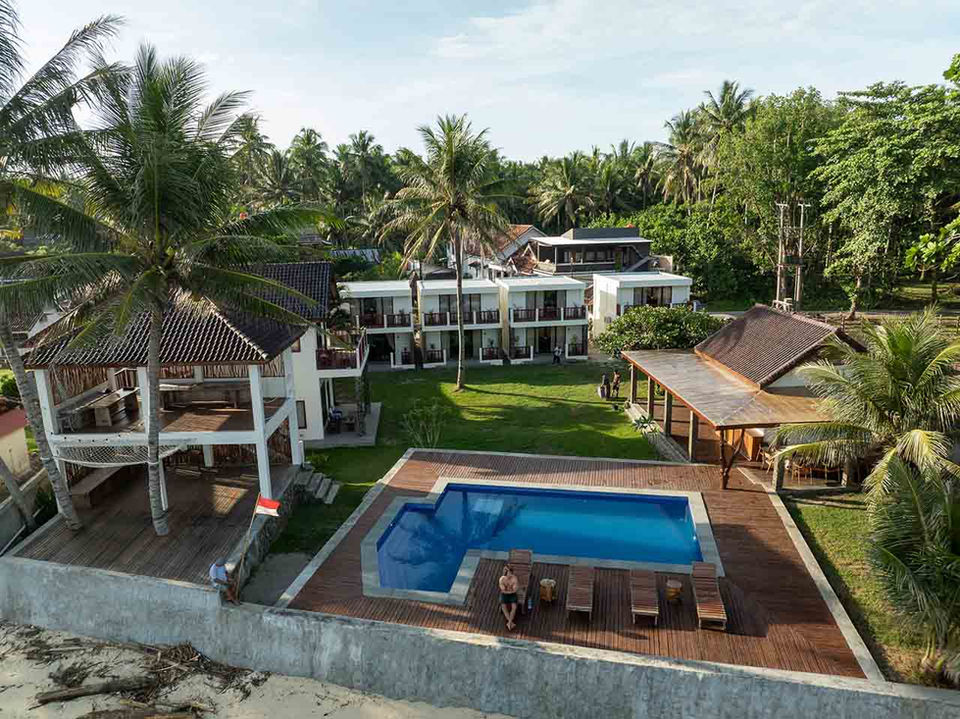 Swimming pool and ocean-view terrace at The Ujung Bocur Bungalows